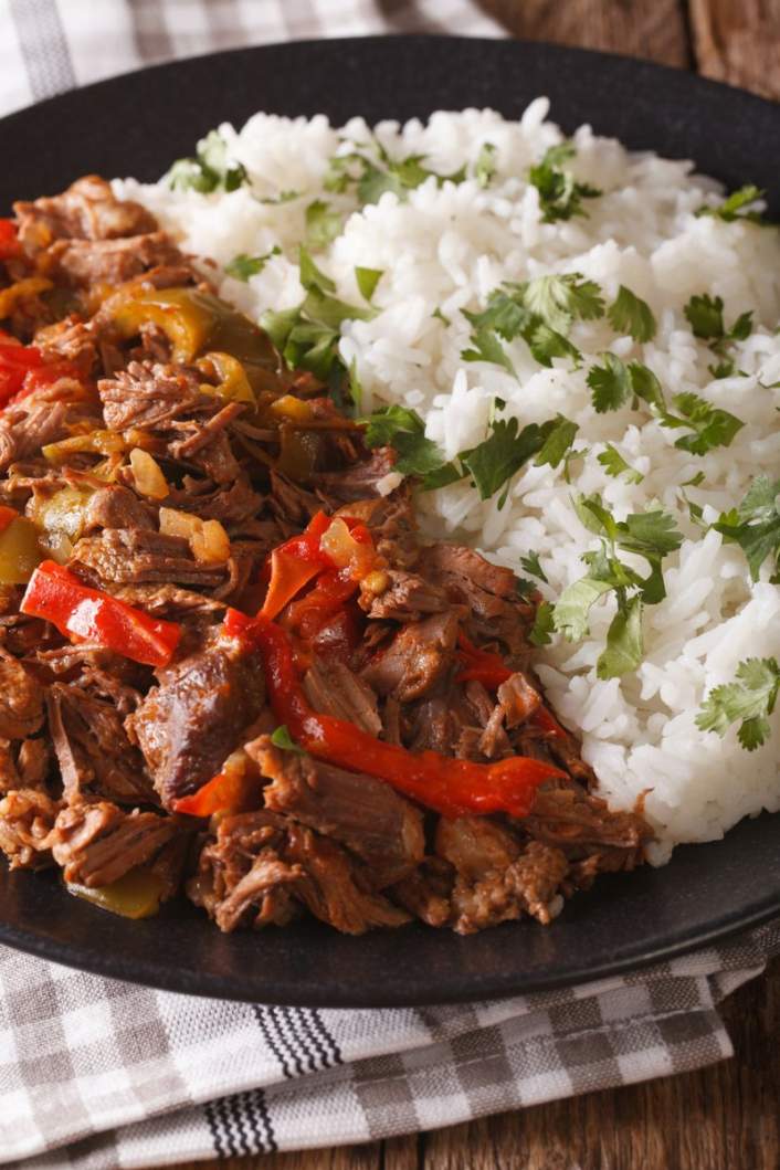 Slow Cooker Beef Machaca with tomatoes, rice, and cilantro.