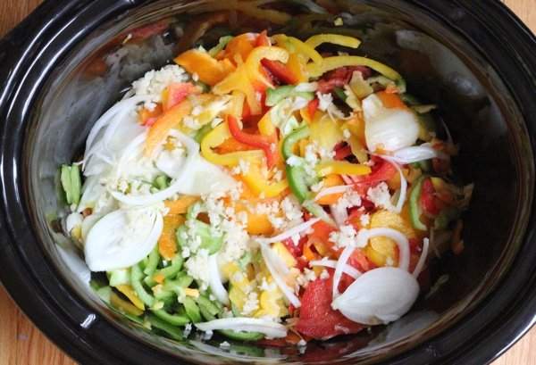 Slow Cooker Chicken Fajitas in the slow cooker with vegetables.