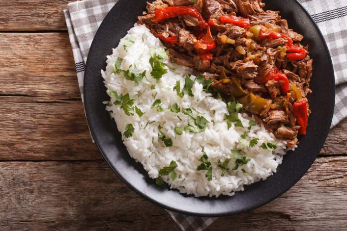 Slow Cooker Beef Machaca on a plate with rice.