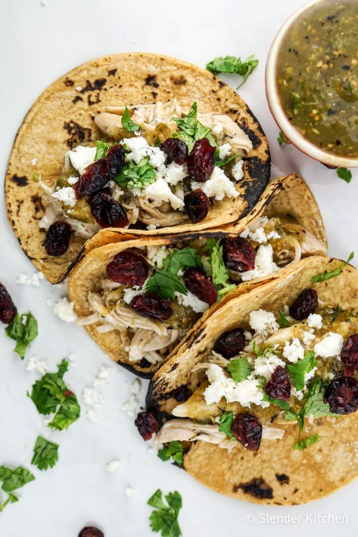 Slow Cooker Turkey Tacos with cranberries on corn tortillas