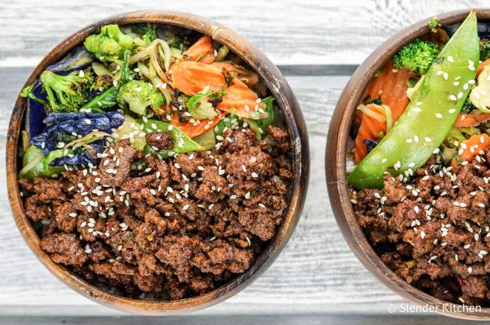 Korean beef with vegetables in wooden bowls.