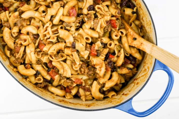 Easy One Pot Chili Mac in a large Dutch oven with pasta, beans, and cheese.