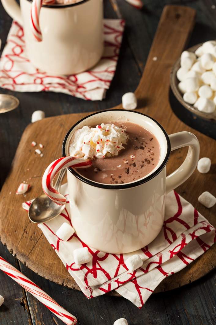 Healthy Peppermint Mocha with a candy cane and whipped cream.