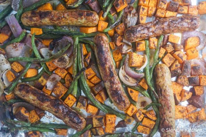 a simple sheet pan supper with sausage, sweet potato, and green beans.
