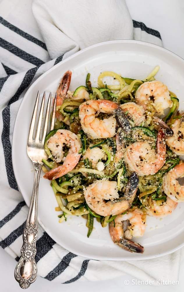 Weight Watchers Pesto Shrimp with Zucchini Noodles on a white linen.