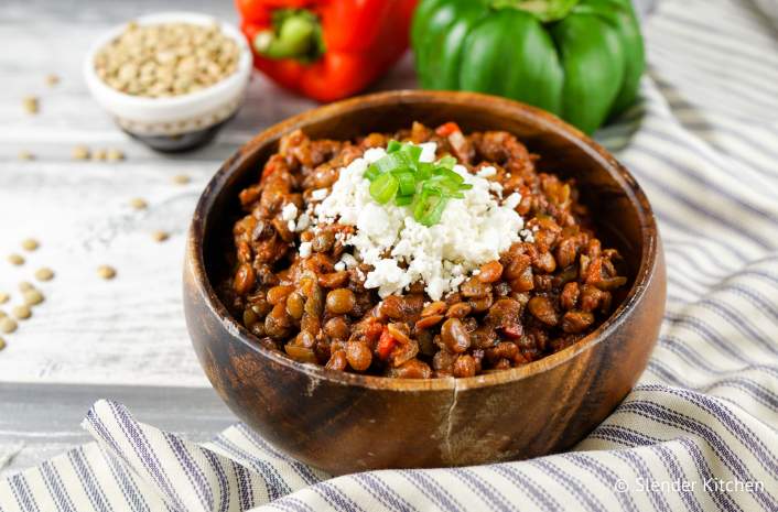 Healthy Crockpot recipe for Tuscan lentils in a wooden bowl.